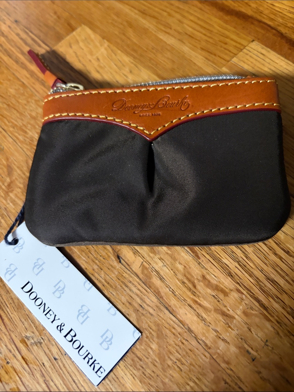 Dooney & Bourke Brown and Tan Zip Coin Pouch. 4.5”
